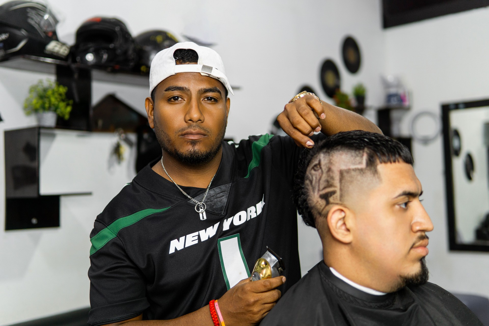 Skillful Barber Giving a Haircut at a Modern Barbershop